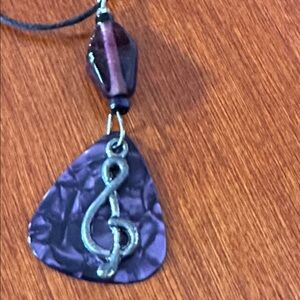 Handcrafted Purple Guitar Pick with Silver Tone Treble Note Black Cord Necklace